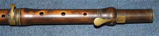 An early 19th century brass mounted concert flute, 23.75in.